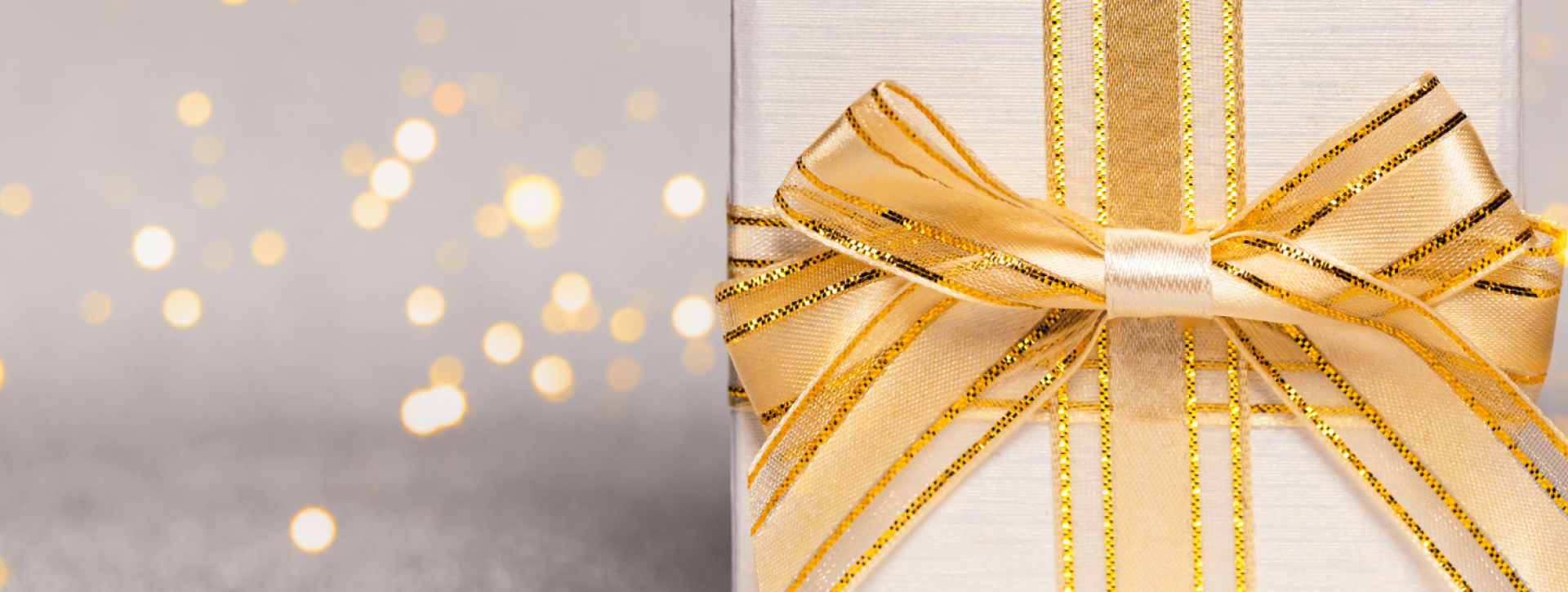 Gold lights with gold present on gray background